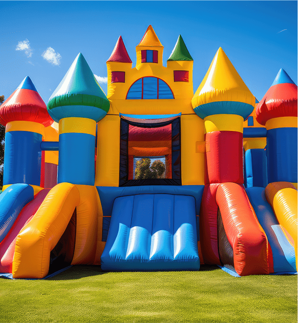 A large inflatable castle featuring a colorful slide