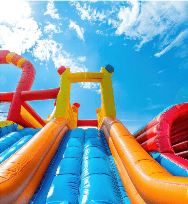 An inflatable slide set against a clear blue sky